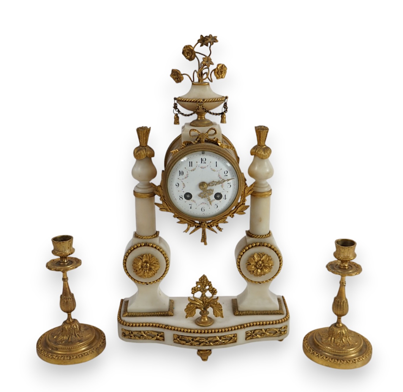 An early 20th century French ormolu mounted white mounted portico clock